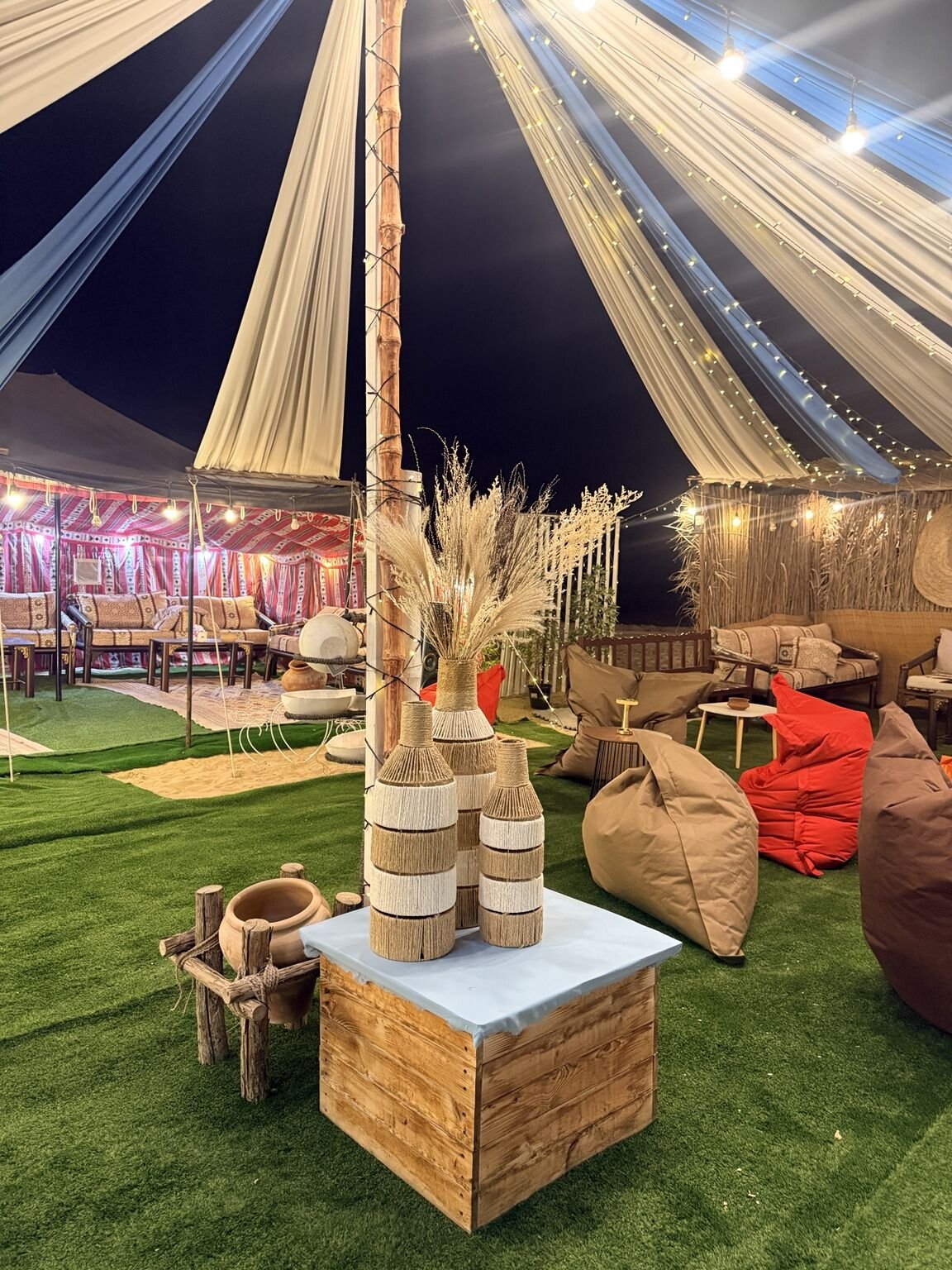 Illuminated private desert camp seating in Al Qudra
